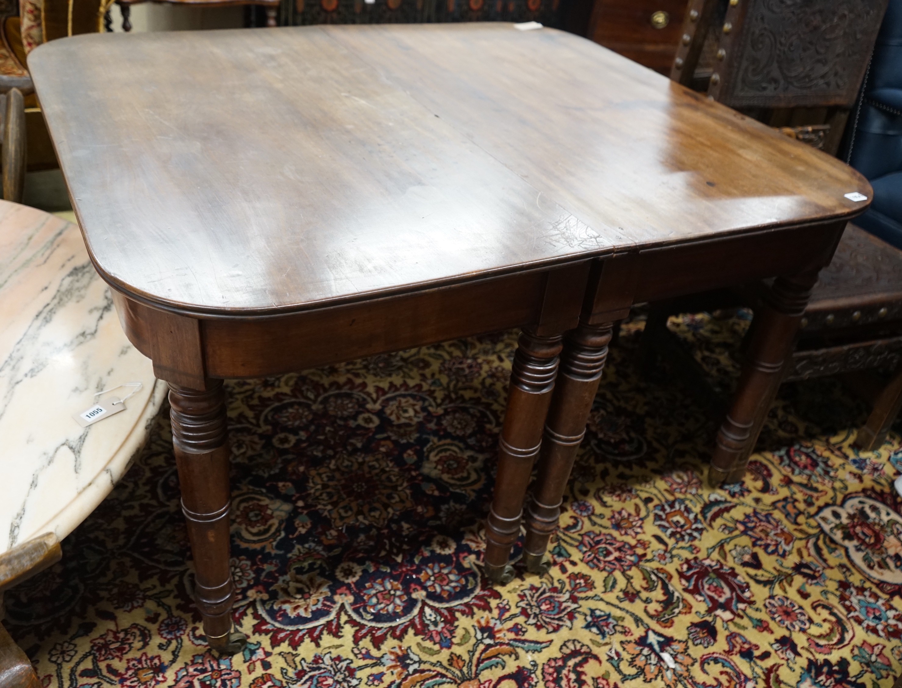 A pair of Regency mahogany table D end sections, length 128cm, depth 112cm, height 72cm